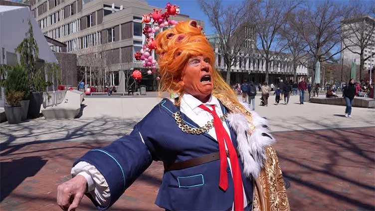 'We're going to stand behind freedom' - Harvard students rally against Trump's demands
